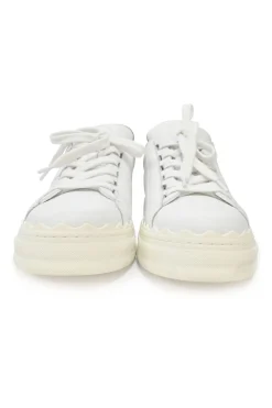 Ivory white calfskin and rubber low-top Lauren sneakers with scalloped sole motif