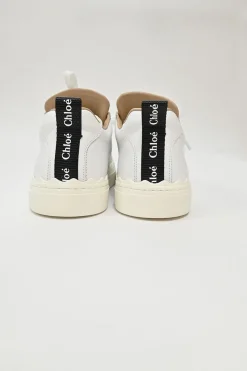 Ivory white calfskin and rubber low-top Lauren sneakers with scalloped sole motif