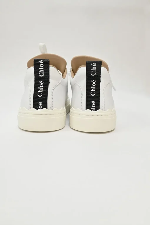 Ivory white calfskin and rubber low-top Lauren sneakers with scalloped sole motif
