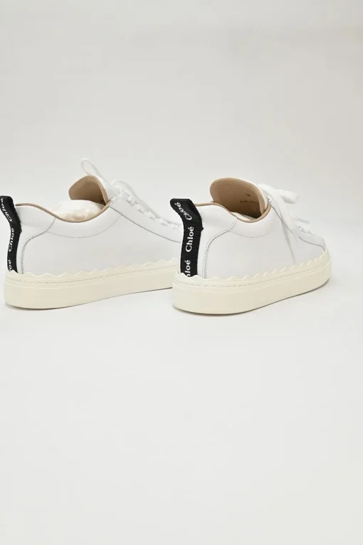 Ivory white calfskin and rubber low-top Lauren sneakers with scalloped sole motif