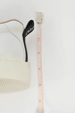 Ivory white calfskin and rubber low-top Lauren sneakers with scalloped sole motif
