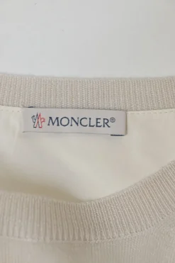 Ivory wool-silk blend mixed-media crewneck pullover swing-style sweater with plissé back panel