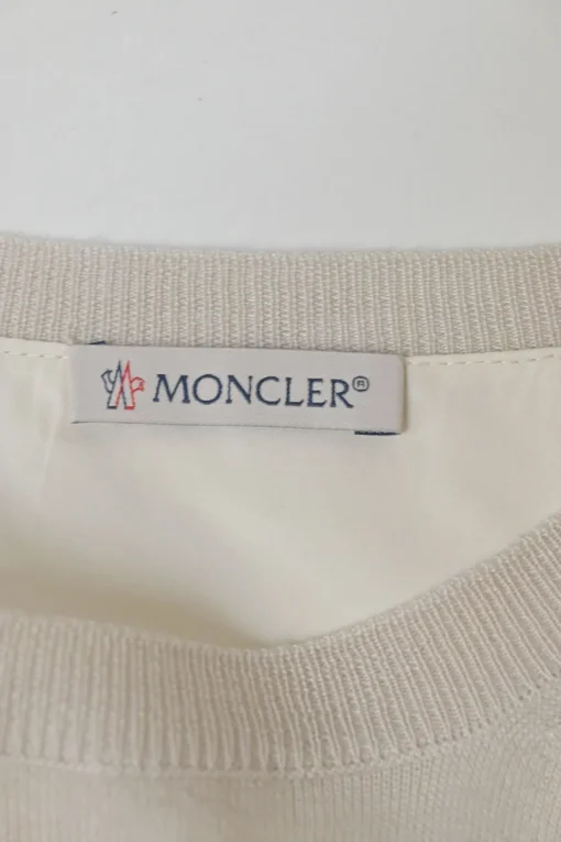 Ivory wool-silk blend mixed-media crewneck pullover swing-style sweater with plissé back panel