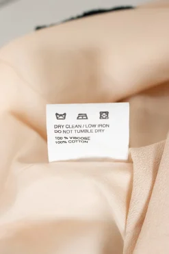 Jacquemus asymmetric skirt, in sand color with round circle embroidered and fringes
