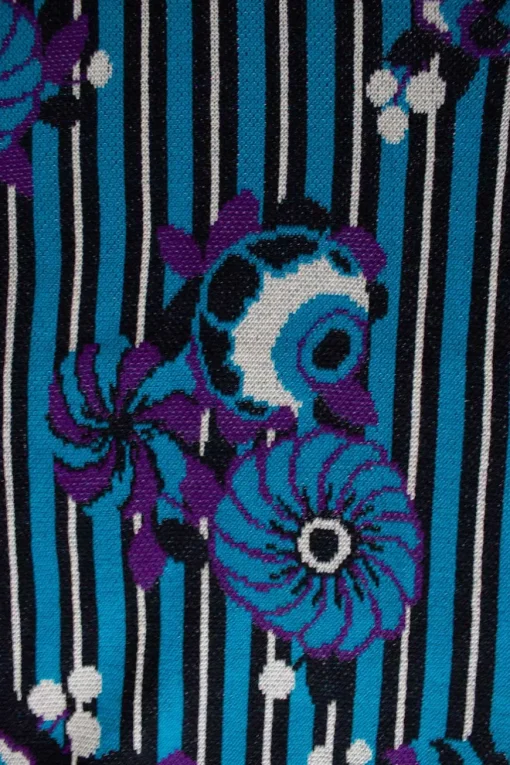 James Coviello x Anna Sui round neck pullover with turquoise, black and white stripes and purple flowers