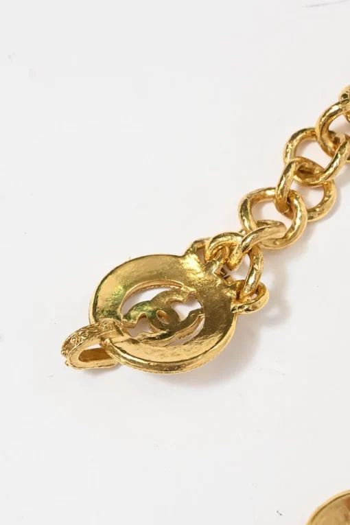 24-karat gold-plated metal Coco Mark medallion charm station chain belt with hook fastening