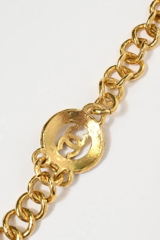 24-karat gold-plated metal Coco Mark medallion charm station chain belt with hook fastening