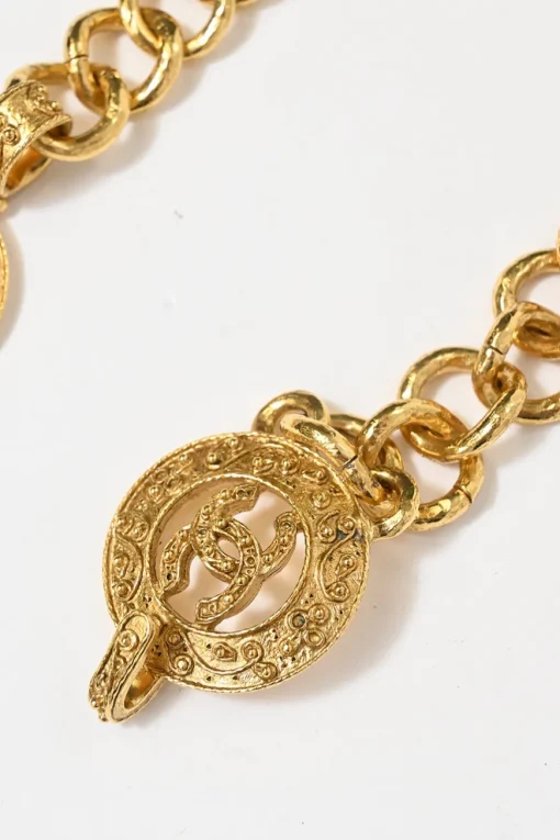 24-karat gold-plated metal Coco Mark medallion charm station chain belt with hook fastening