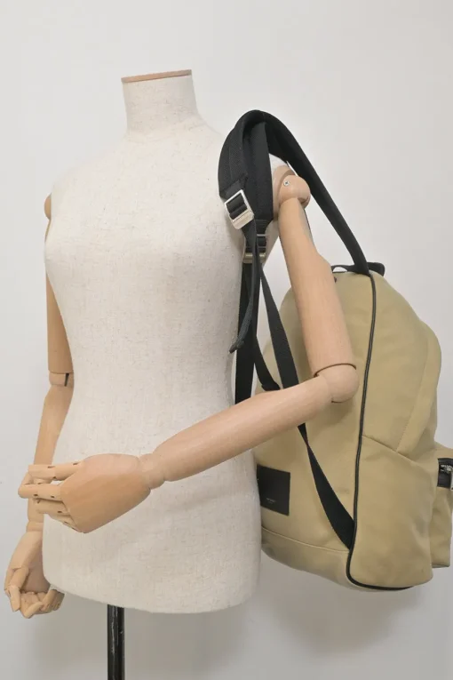 Khaki and black canvas and leather City backpack