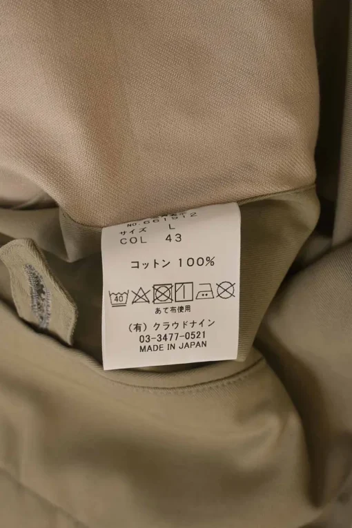 Khaki cotton gabardine pull-on pleat-front tailored trousers with belt tab cuffs