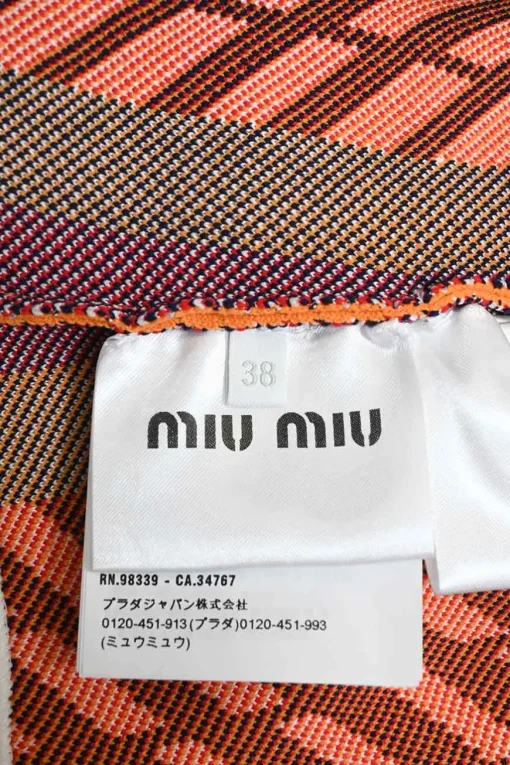 Light grey polyamide-blend jacquard knit high-rise mini shorts with orange, red and black geometric details