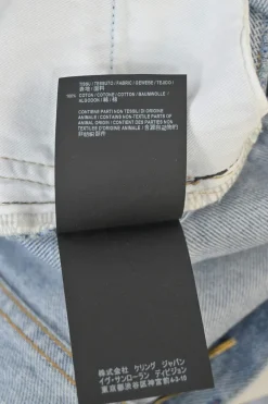 Light-wash indigo cotton denim mid-rise straight-leg distressed jeans