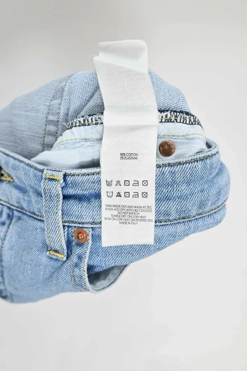 Lightwash raw edge cotton-blend denim pull-on mid-rise kick-flare jeans