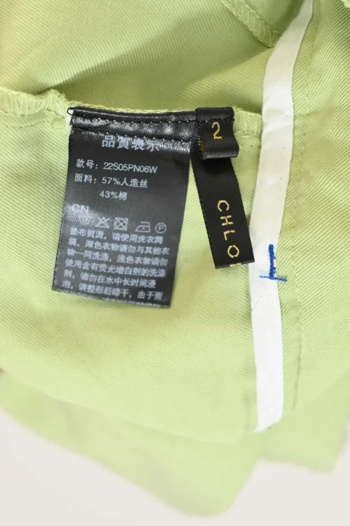 Lime green rayon-blend twill pull-on high-rise pleated straight leg trousers with elasticated waistband