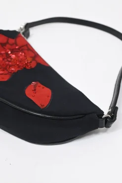 Limited Edition black nylon Saddle Pochette bag with red sequin-embellished floral appliqué
