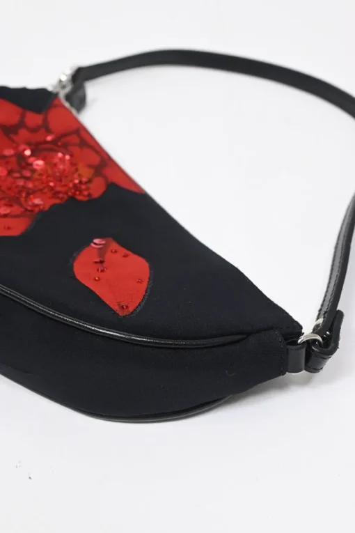 Limited Edition black nylon Saddle Pochette bag with red sequin-embellished floral appliqué