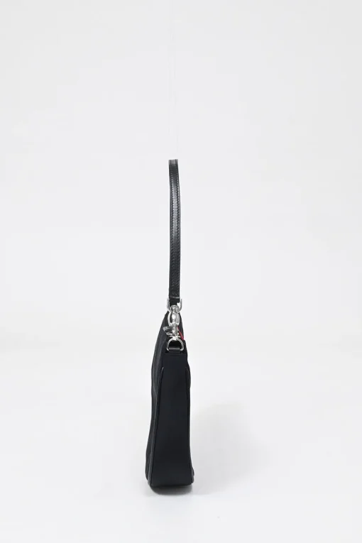 Limited Edition black nylon Saddle Pochette bag with red sequin-embellished floral appliqué