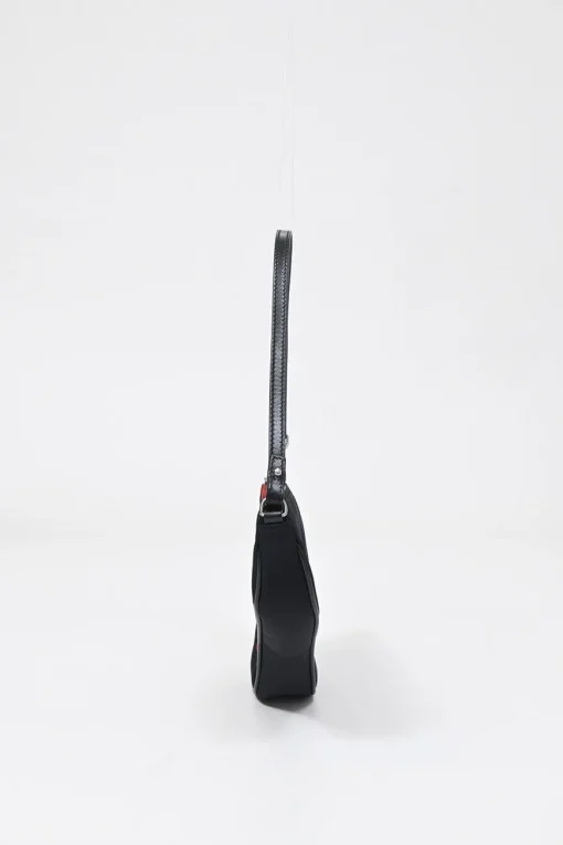 Limited Edition black nylon Saddle Pochette bag with red sequin-embellished floral appliqué