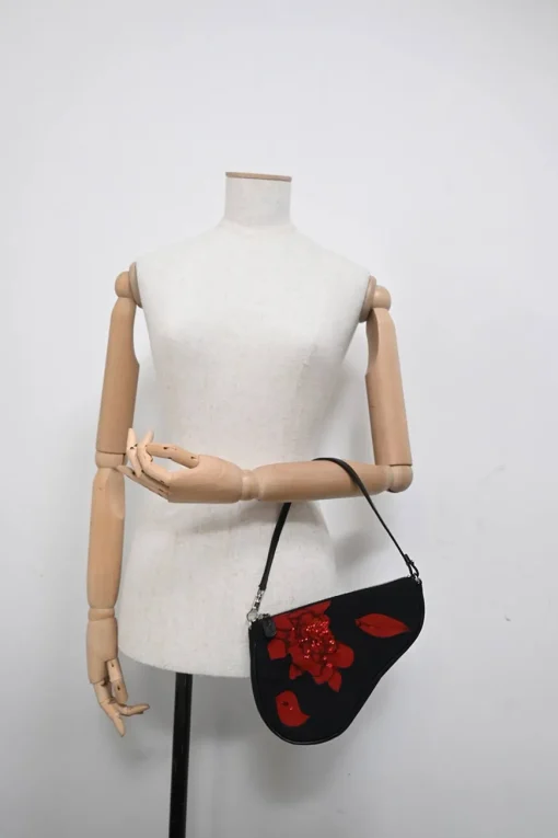 Limited Edition black nylon Saddle Pochette bag with red sequin-embellished floral appliqué