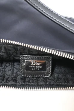 Limited Edition black nylon Saddle Pochette bag with red sequin-embellished floral appliqué