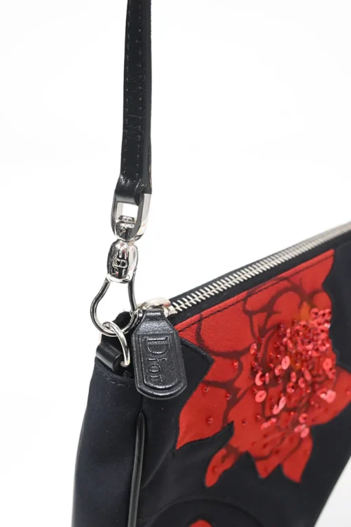 Limited Edition black nylon Saddle Pochette bag with red sequin-embellished floral appliqué