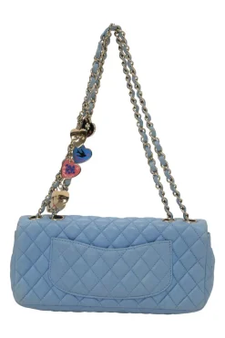 Limited release blue matelassé leather Valentine East West flap bag with enamel logo charm strap appliqué