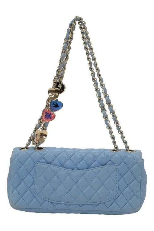 Limited release blue matelassé leather Valentine East West flap bag with enamel logo charm strap appliqué