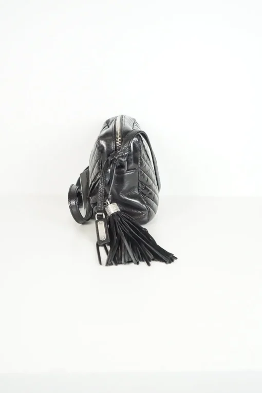 Lou camera bag; MONOGRAM SHOULDER BAG in wrinkled black leather with  AN ADJUSTABLE LEATHER STRAP.