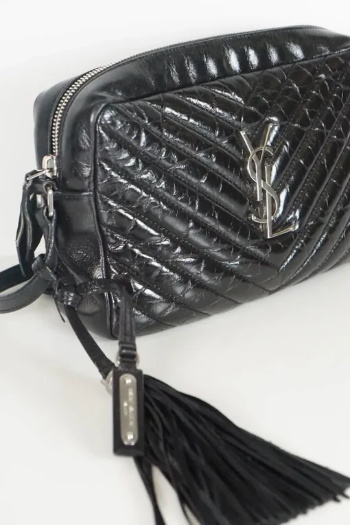 Lou camera bag; MONOGRAM SHOULDER BAG in wrinkled black leather with  AN ADJUSTABLE LEATHER STRAP.