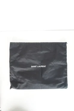 Lou camera bag; MONOGRAM SHOULDER BAG in wrinkled black leather with  AN ADJUSTABLE LEATHER STRAP.
