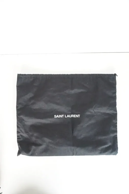 Lou camera bag; MONOGRAM SHOULDER BAG in wrinkled black leather with  AN ADJUSTABLE LEATHER STRAP.