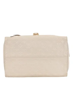 Louis Vuitton Empreinte monogram embossed calf leather bag in cream colour with zip closure. Rectangular shape with 2 shoulder straps. Bag has one external zipped pocket. Interior is fabric lined, with two side pockets, and a third on front panel. Gold toned hardware.