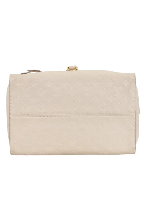 Louis Vuitton Empreinte monogram embossed calf leather bag in cream colour with zip closure. Rectangular shape with 2 shoulder straps. Bag has one external zipped pocket. Interior is fabric lined, with two side pockets, and a third on front panel. Gold toned hardware.