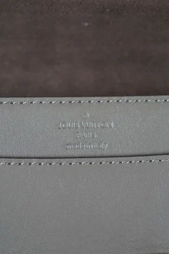 Louis Vuitton grey Chain Louise GM leather crossbody bag with gold tone hardware