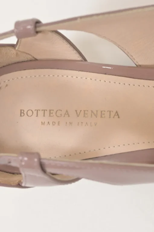 Mauve patent leather cutout slingback court pumps with chiseled square toe and buckle strap fastening
