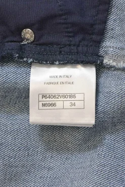 Mid-wash indigo cotton denim tuck-pleat high-rise straight leg jeans