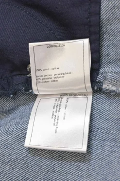 Mid-wash indigo cotton denim tuck-pleat high-rise straight leg jeans