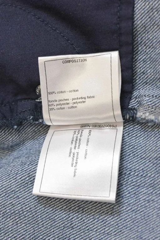 Mid-wash indigo cotton denim tuck-pleat high-rise straight leg jeans
