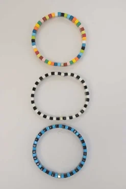 Multi-colour metal and enamel stacked stretch bracelets