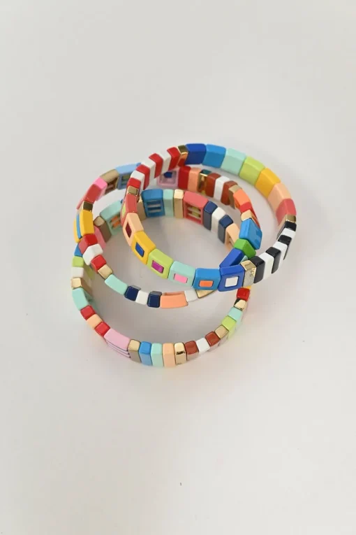 Multi-coloured enamel and gold-tone metal Cherry Bomb bracelet set