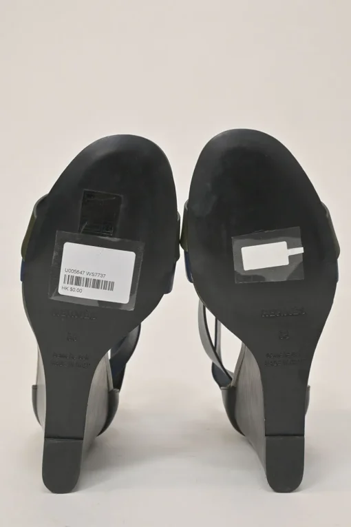 Navy and olive green leather round-toe criss-cross wedge sandals with buckle strap fastening