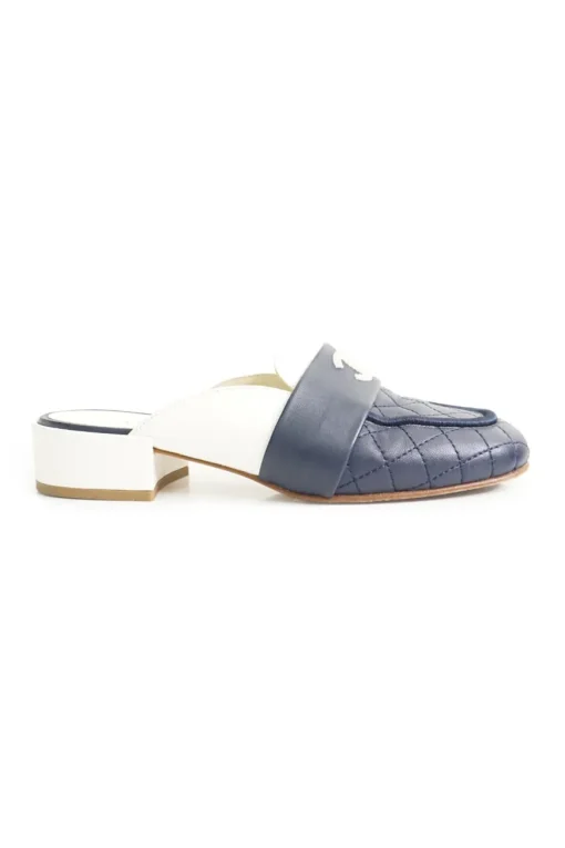 Navy and white quilted leather square-toe mules with beaded Coco Mark at vamp