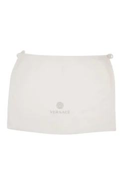 Navy and white stripe leather bag with gold-tone ornament and leather floral applique, comes with detachable cross-body strap