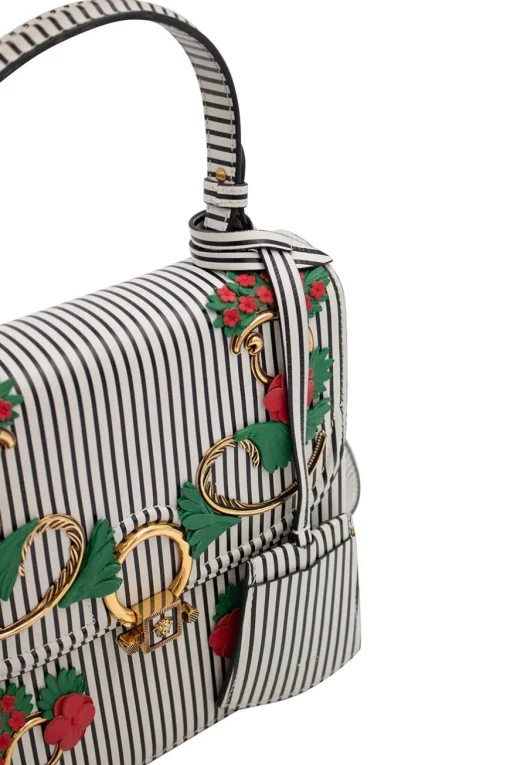 Navy and white stripe leather bag with gold-tone ornament and leather floral applique, comes with detachable cross-body strap