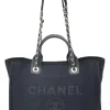 Navy blue lambskin leather-trimmed canvas Small Deauville Tote bag with gold-tone hardware