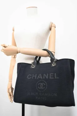 Navy blue lambskin leather-trimmed canvas Small Deauville Tote bag with gold-tone hardware