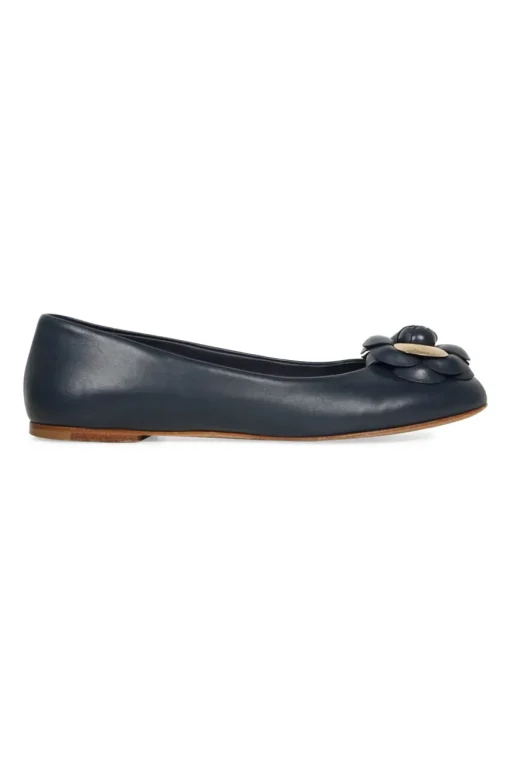 Navy calfskin camellia ballerinas with contrast metallic petal and brand-signature Coco Mark plaque