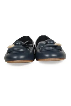 Navy calfskin camellia ballerinas with contrast metallic petal and brand-signature Coco Mark plaque