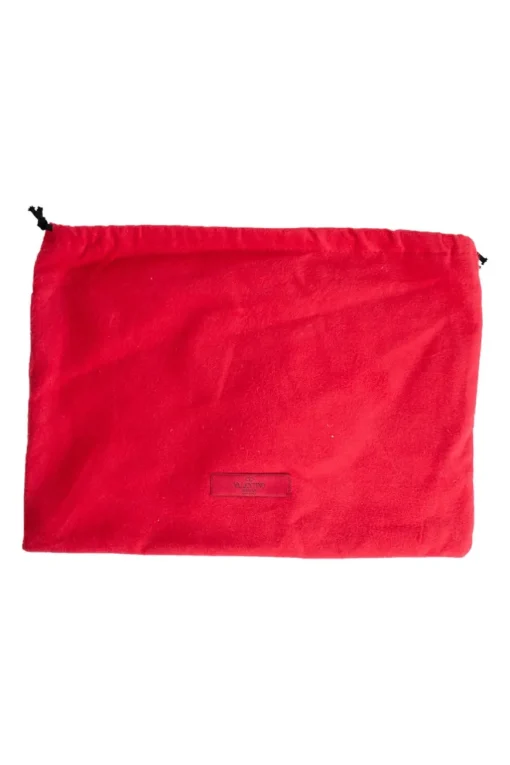 Navy clutch with wrist strap and brand stamp
