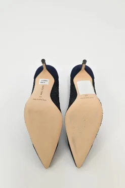 Navy lace and leather pointed toe pumps